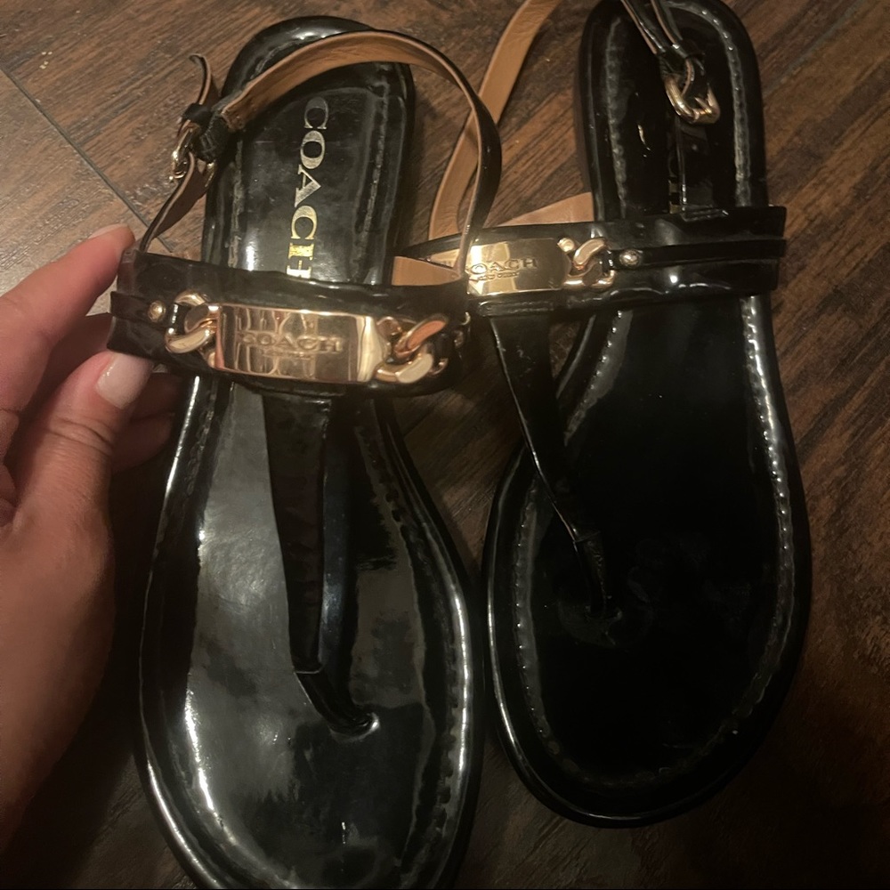 Black leather coach sandals